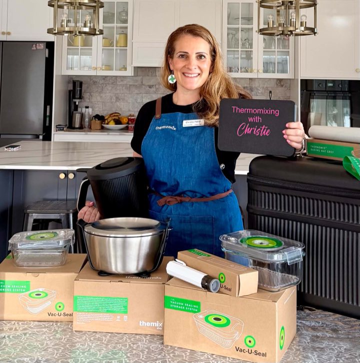 Christie Pabari smiling in her kitchen with Thermomix products